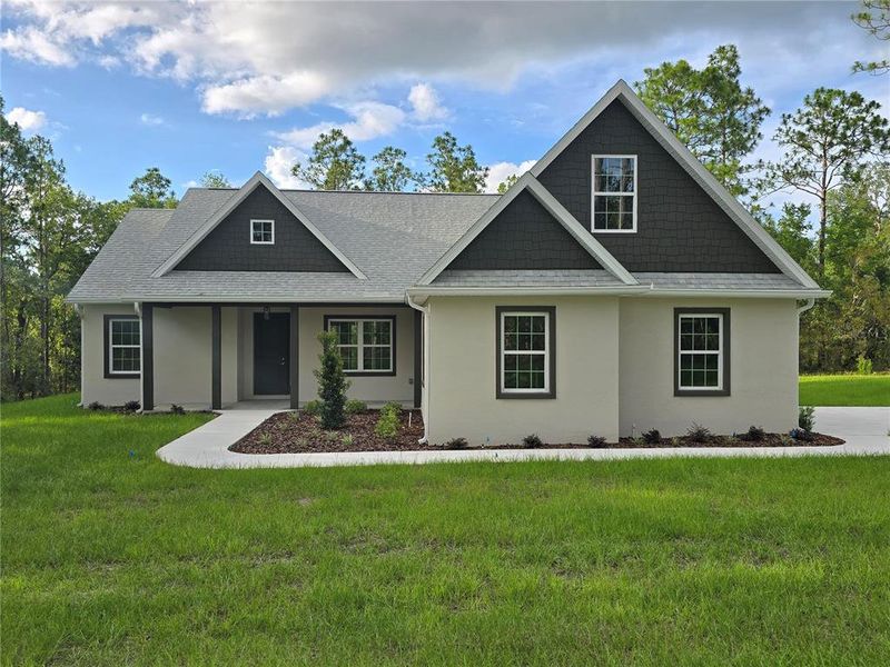 Front exterior of a new home in , Weeki Wachee, FL, highlighting curb appeal (Image 2). Front exterior of a new home in , Weeki Wachee, FL, highlighting curb appeal (Image 2).