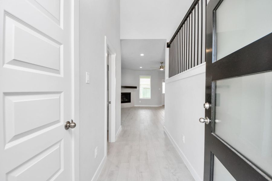 As you step into the threshold of this luxurious home, you'll soon be welcomed by an elegant glass door (to be installed). Inside, soaring ceilings amplify the spaciousness, while the refined wood-look tile flooring and oversized baseboards exude sophistication and charm. Sample photo of completed home with similar floor plan. Actual colors and selections may vary. As you step into the threshold of this luxurious home, you'll soon be welcomed by an elegant glass door (to be installed). Inside, soaring ceilings amplify the spaciousness, while the refined wood-look tile flooring and oversized baseboards exude sophistication and charm. Sample photo of completed home with similar floor plan. Actual colors and selections may vary.