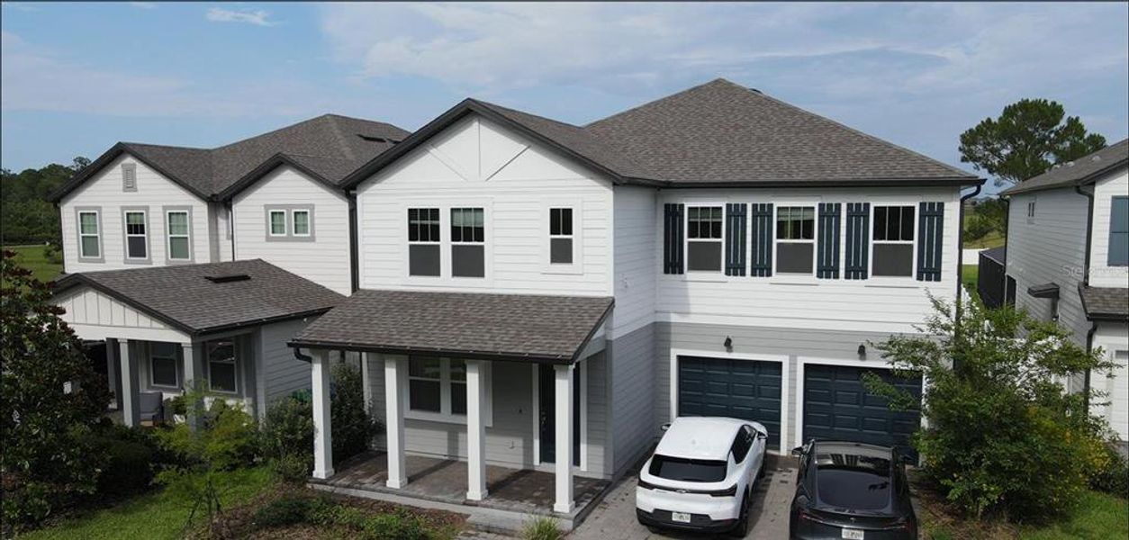 Front exterior of a new home in , Winter Garden, FL, highlighting curb appeal (Image 25). Front exterior of a new home in , Winter Garden, FL, highlighting curb appeal (Image 25).