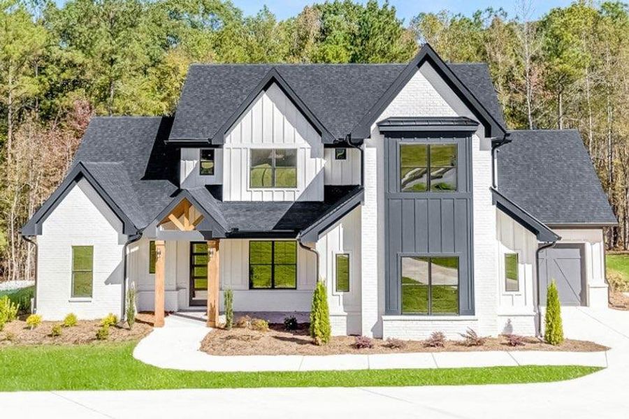Front exterior of a new home in , Newnan, GA, highlighting curb appeal (Image 25). Front exterior of a new home in , Newnan, GA, highlighting curb appeal (Image 25).