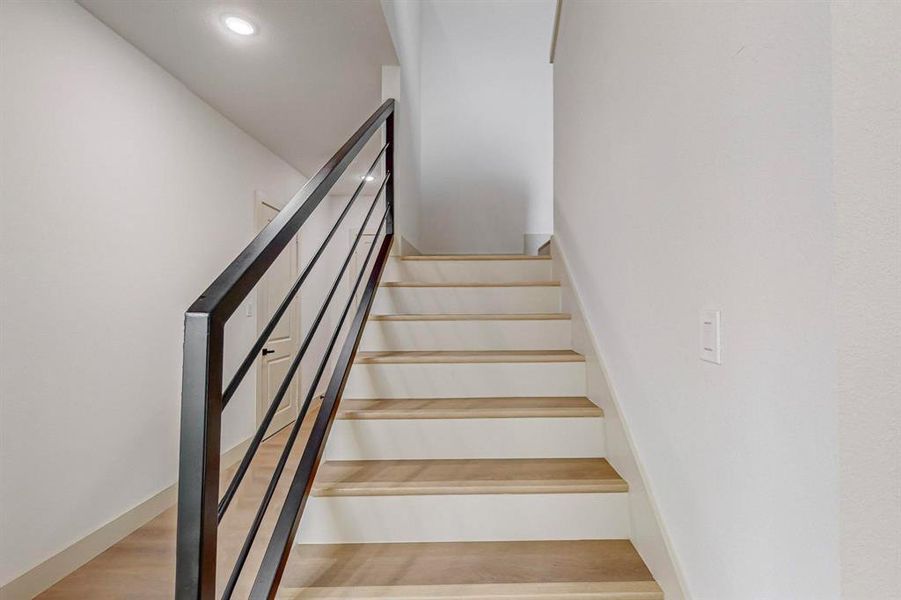 Stairs with hardwood / wood-style flooring