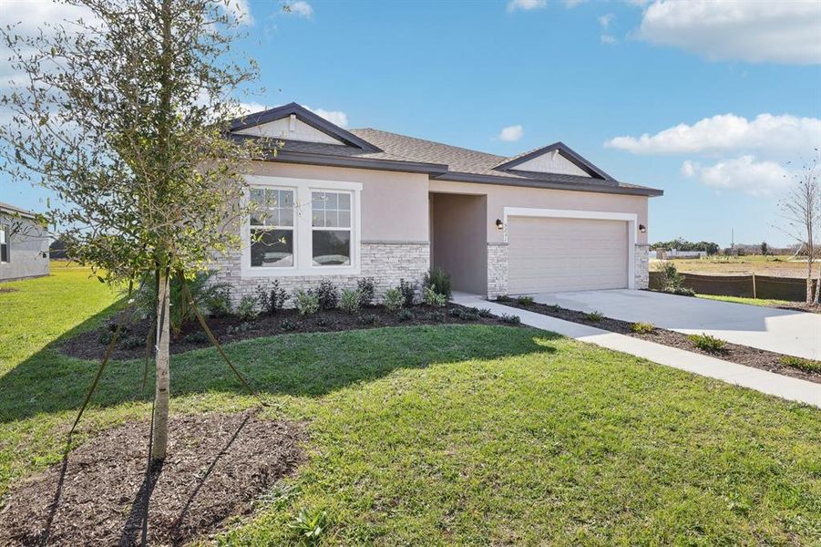 Front exterior of a new home in Tyson Reserve, St. Cloud, FL, highlighting curb appeal (Image 1). Front exterior of a new home in Tyson Reserve, St. Cloud, FL, highlighting curb appeal (Image 1).