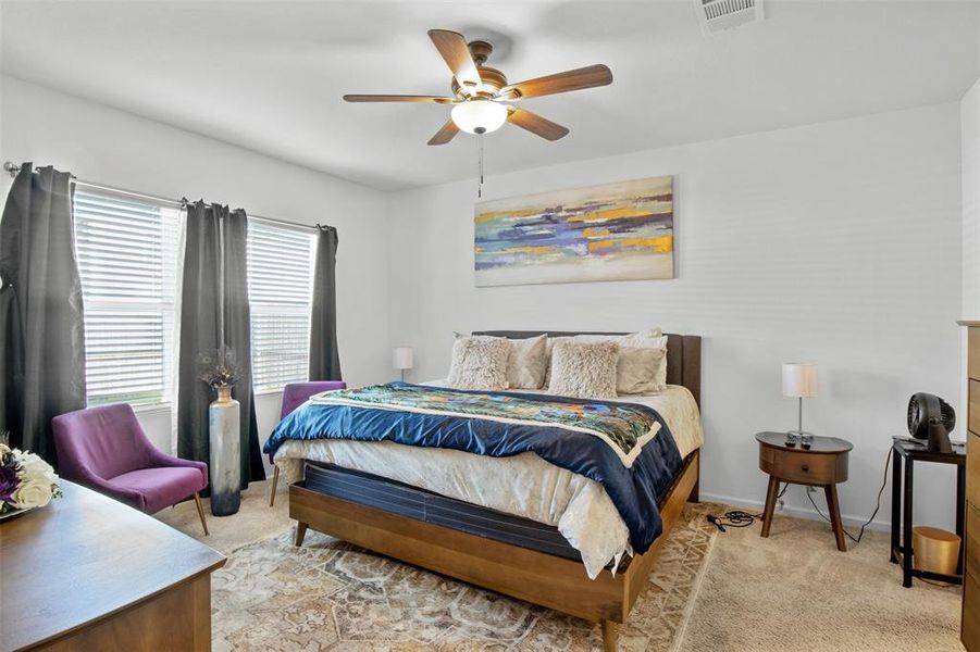 Bedroom with carpet and ceiling fan