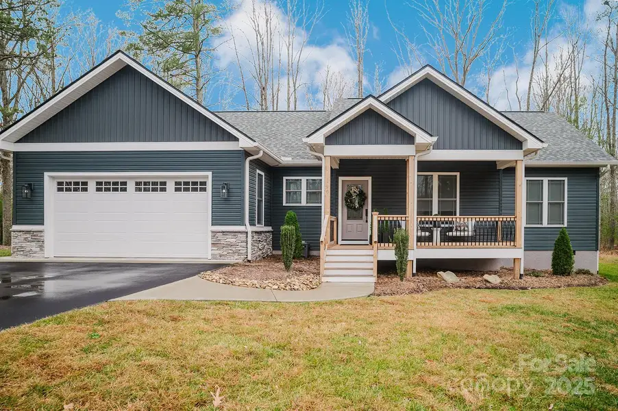 Front exterior of a new home in , Hendersonville, NC, highlighting curb appeal (Image 1). Front exterior of a new home in , Hendersonville, NC, highlighting curb appeal (Image 1).