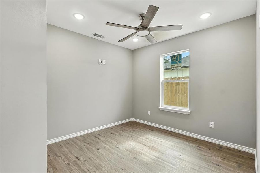 Unfurnished room featuring a ceiling fan, light wood finished floors, and recessed lighting Unfurnished room featuring a ceiling fan, light wood finished floors, and recessed lighting