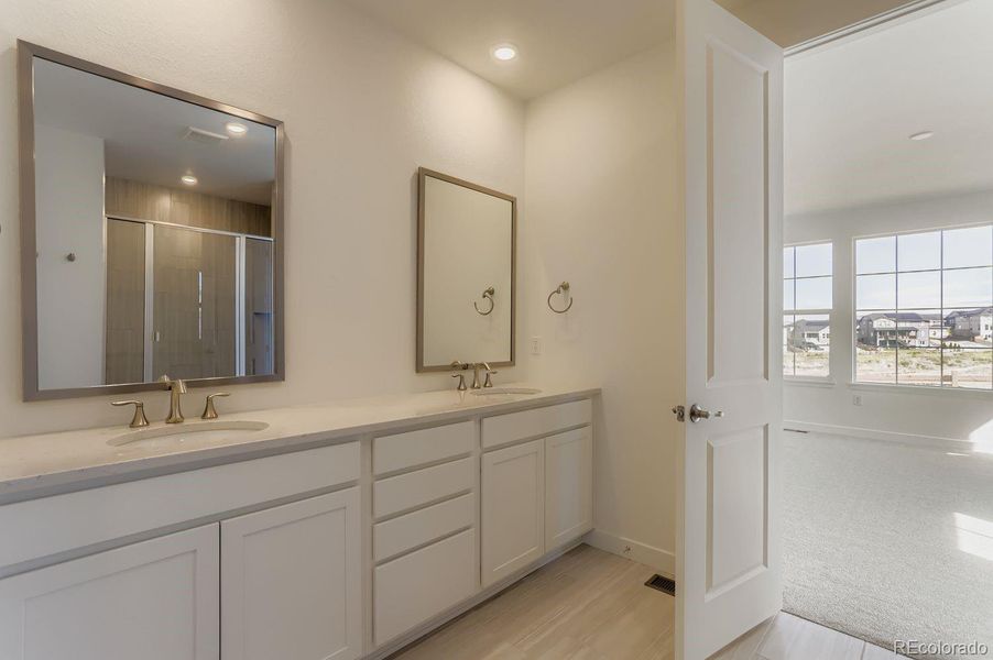 Furnished interior view inside a new home in Sunset Village: The Grand Collection, Erie (Image 6).