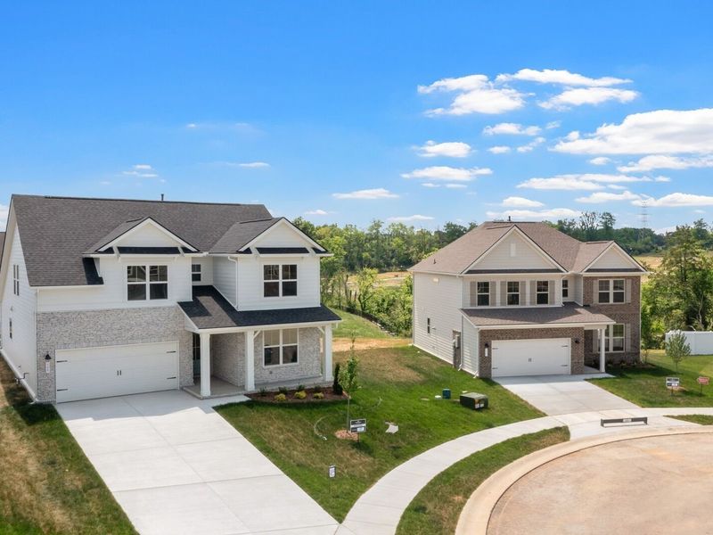 Front exterior of a new home in Woods Crossing, Gallatin, TN, highlighting curb appeal (Image 1). Front exterior of a new home in Woods Crossing, Gallatin, TN, highlighting curb appeal (Image 1).
