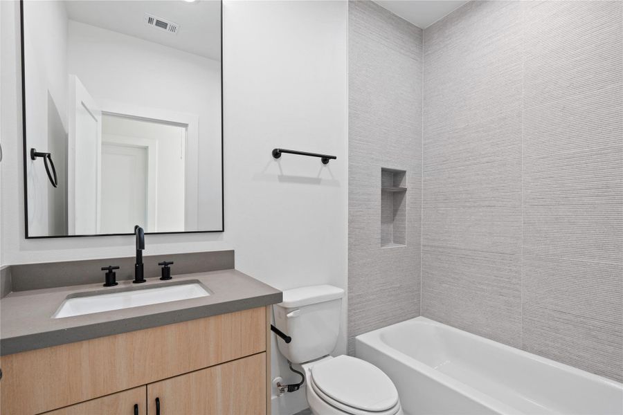 Every bedroom in the home features its own private bathroom, offering both convenience and personal retreat space for family and guests. This thoughtful design ensures privacy while maintaining a cohesive, stylish aesthetic throughout