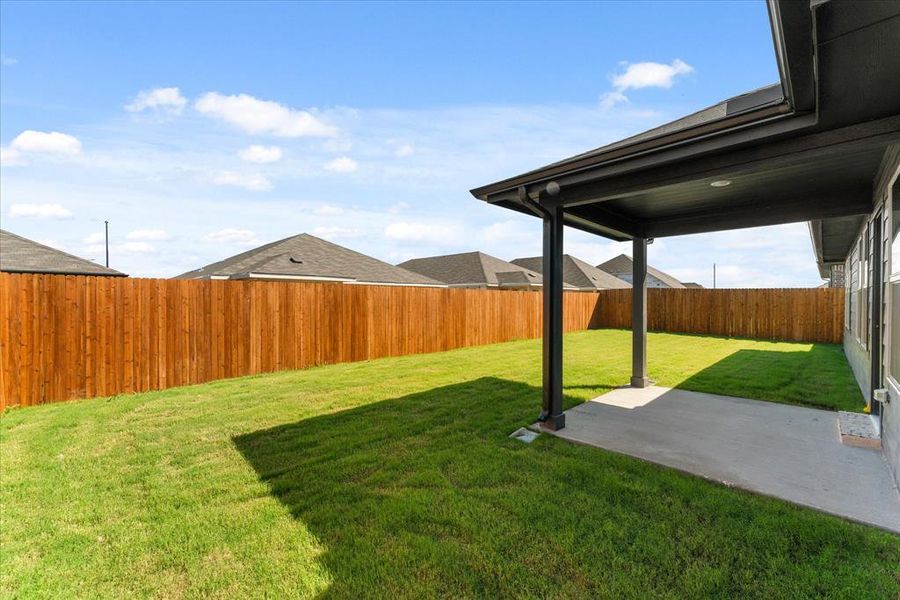 View of yard with a covered patio area