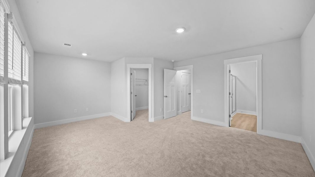 Primary suite that offers relaxation with established style and elevated finishes at Saluda Crossing in Piedmont, SC