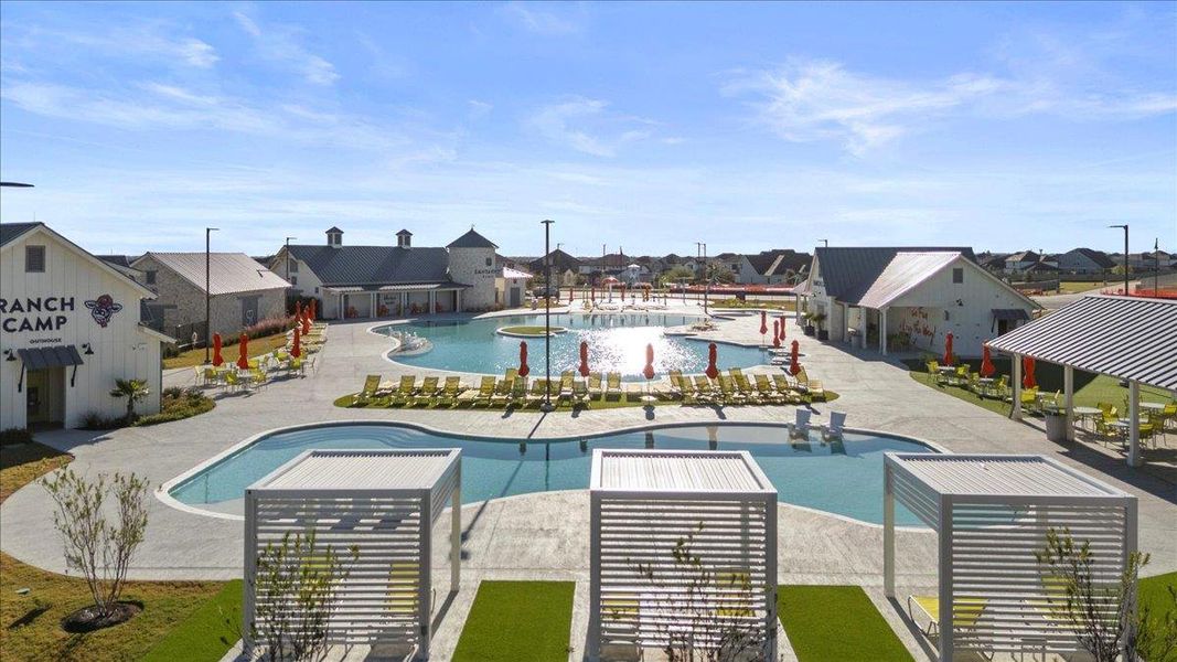 Community pool with a patio and a residential view Community pool with a patio and a residential view