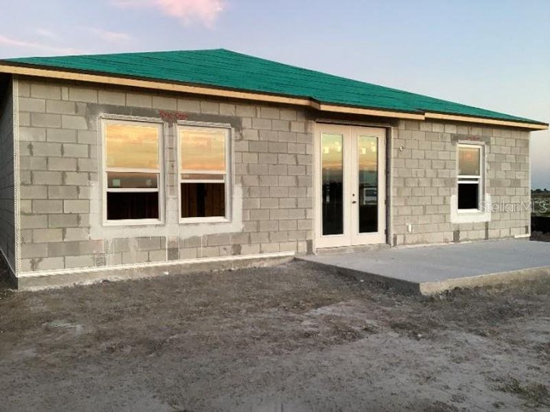 Exterior details and patio area of a home in Catamaran Cove Traditional, Rockledge (Image 3).