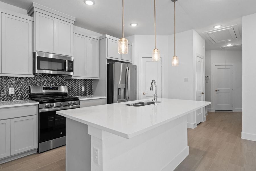 Furnished interior view inside a new home in Meridiana, Iowa Colony (Image 8).