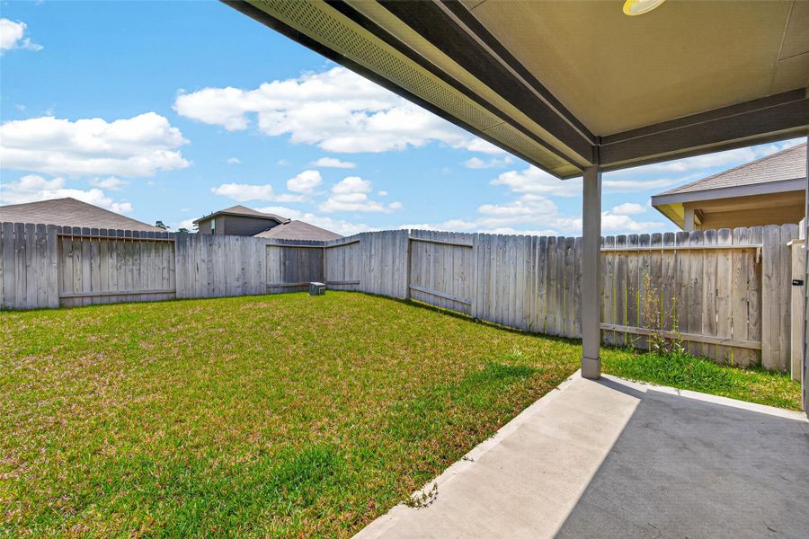 Exterior details and patio area of a home in Breckenridge Forest, Spring (Image 25).