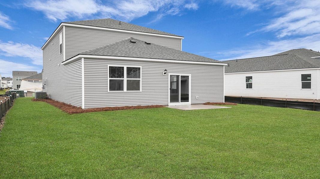 Exterior details and patio area of a home in Pine Hills at Cane Bay, Summerville (Image 20).