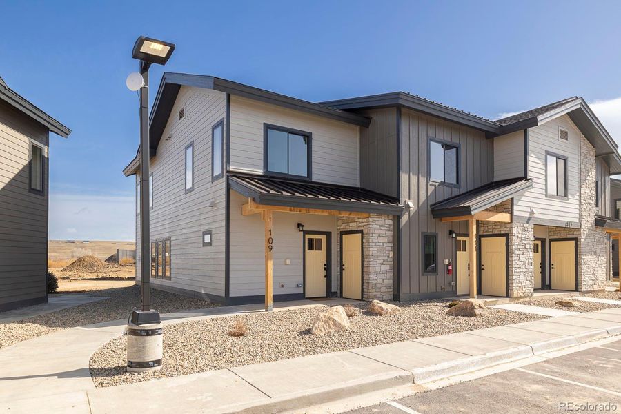 Front exterior of a new home in , Granby, CO, highlighting curb appeal (Image 1). Front exterior of a new home in , Granby, CO, highlighting curb appeal (Image 1).