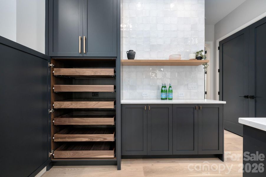 Spectacular Custom Cabinetry Storage and Bar Space