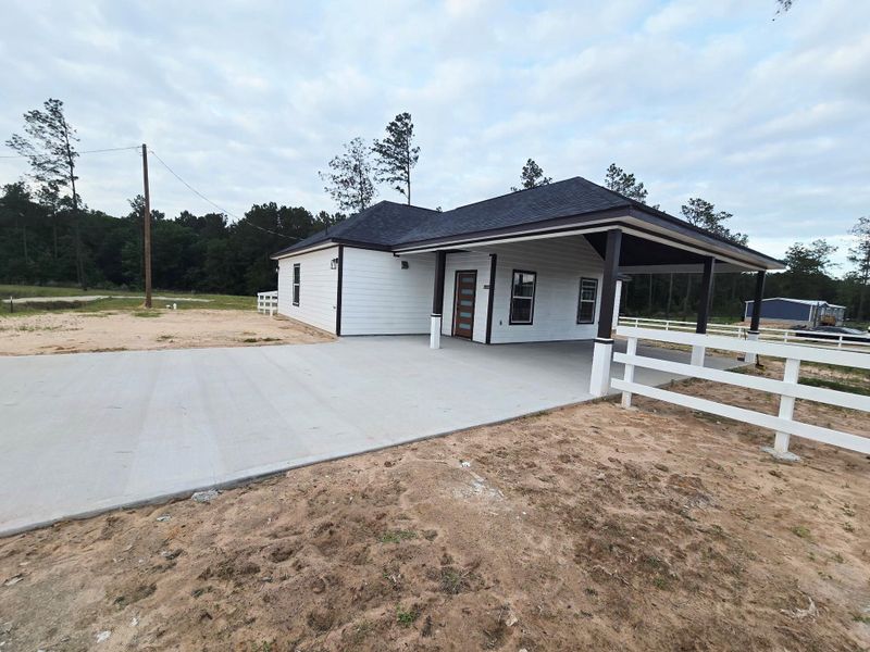 Exterior details and patio area of a home in , Conroe (Image 13).