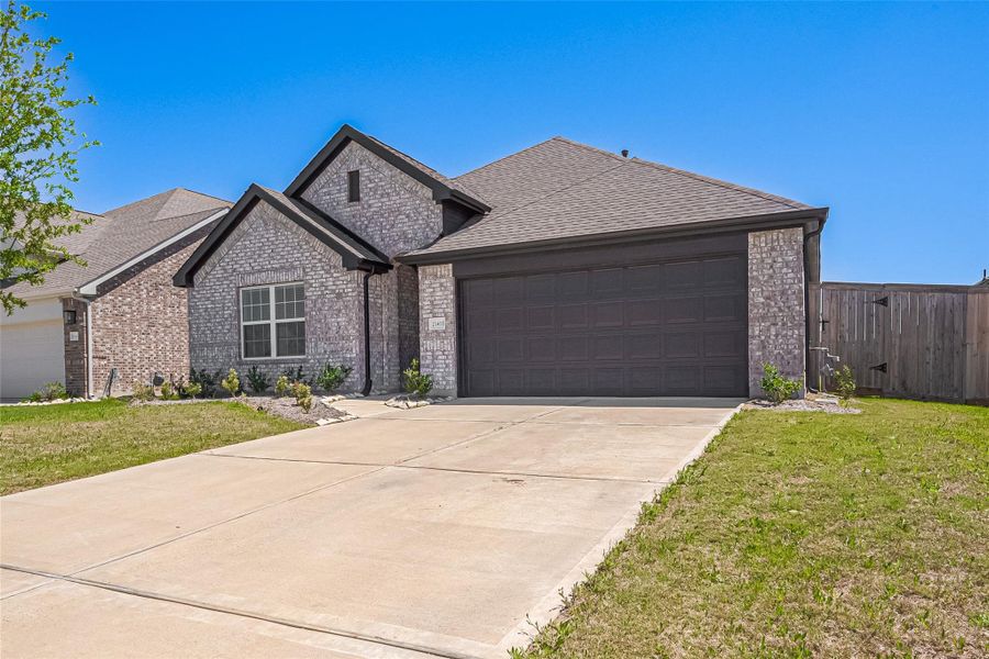 Front exterior of a new home in Oakwood Estates, Waller, TX, highlighting curb appeal (Image 18). Front exterior of a new home in Oakwood Estates, Waller, TX, highlighting curb appeal (Image 18).