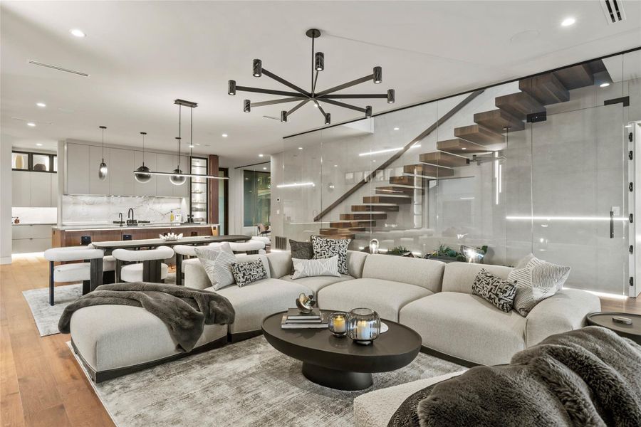 Open-concept living space with wood-finish flooring