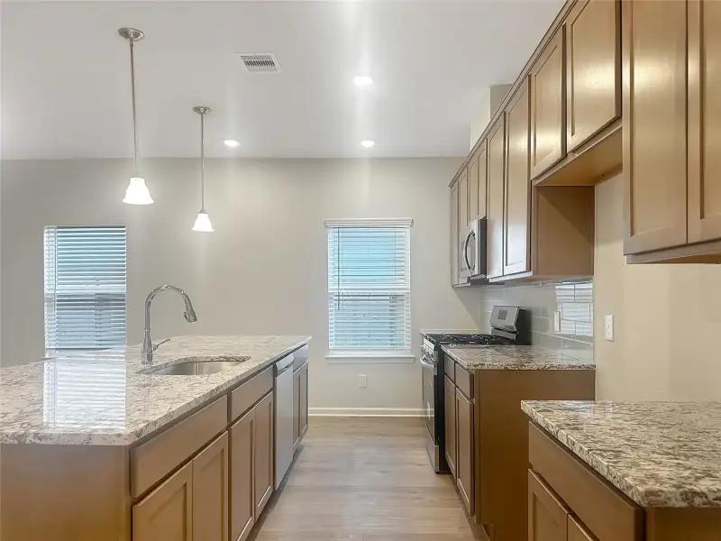 The Crawford- Kitchen. Home is under construction, photos used for illustration only; actual features, colors, and upgrades may vary.