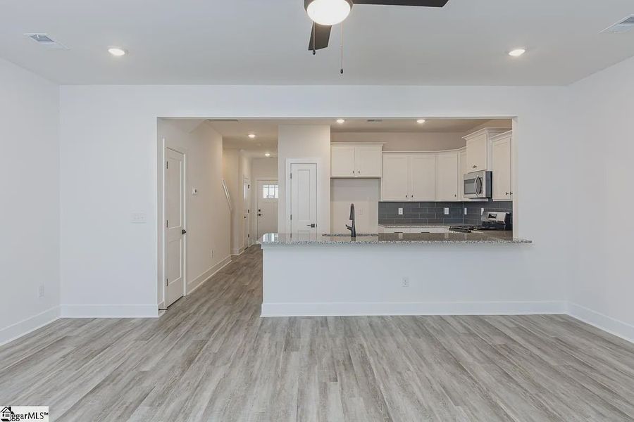 Representative unfurnished interior of a home built from the 1568 Townhome by Adams Homes in Parkstone Place Townhomes, Roebuck (Image 12). Representative unfurnished interior of a home built from the 1568 Townhome by Adams Homes in Parkstone Place Townhomes, Roebuck (Image 12).