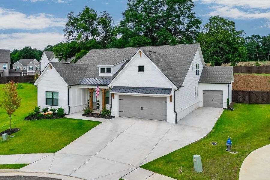 Front exterior of a new home in Rosewood Lake Estates, Hoschton, GA, highlighting curb appeal (Image 20). Front exterior of a new home in Rosewood Lake Estates, Hoschton, GA, highlighting curb appeal (Image 20).