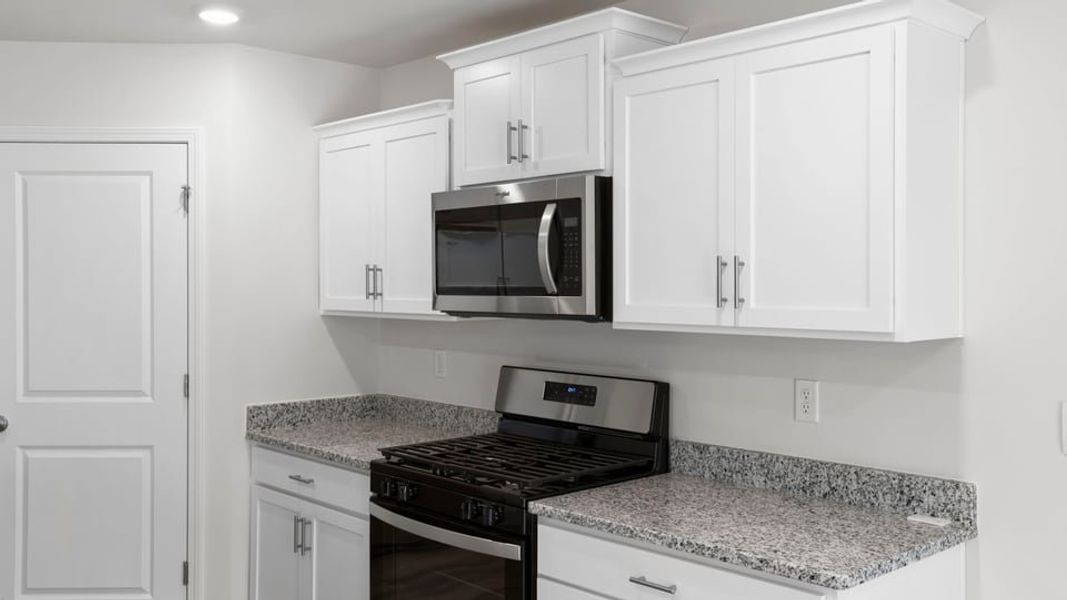 Furnished interior view inside a new home in Lakestone, Woodruff (Image 9).