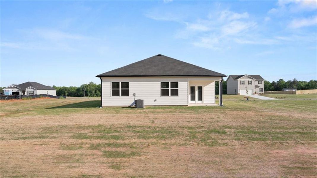 Front exterior of a new home in Champion's Run, Lithonia, GA, highlighting curb appeal (Image 2).