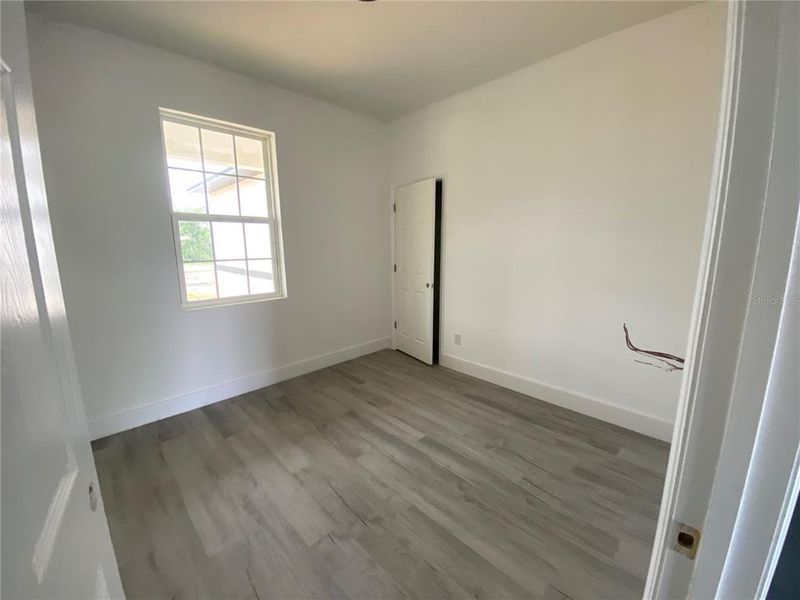bedroom with wood laminate