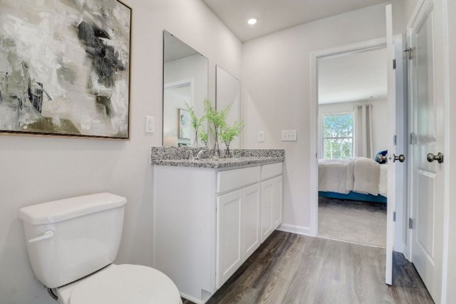 A bathroom with a marble countertop. A bathroom with a marble countertop.