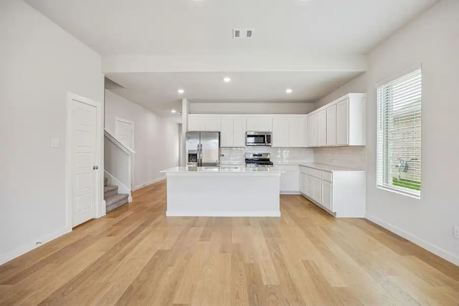 Kitchen in the Stanley II home plan by Trophy Signature Homes – REPRESENTATIVE PHOTO