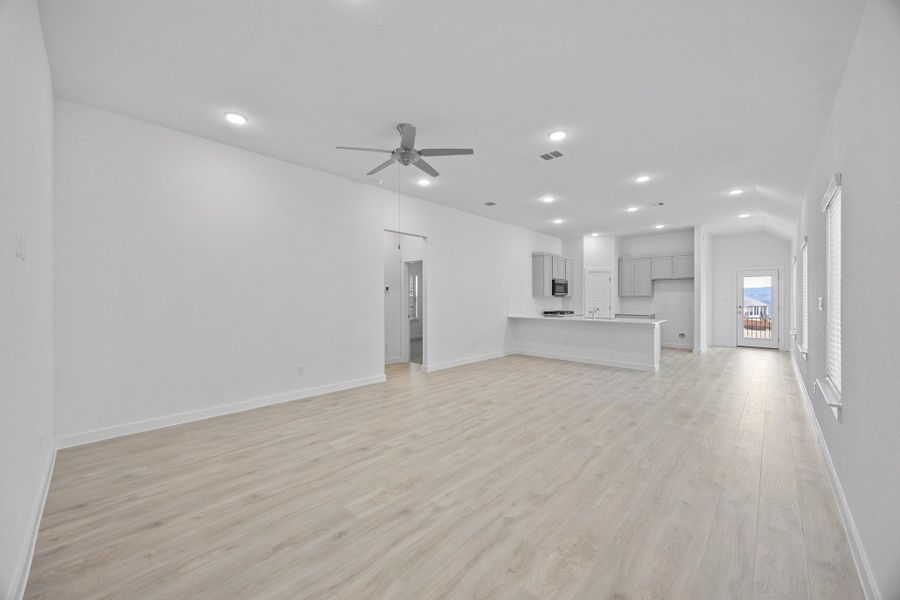 Living and Dining Area in the Pecan II home plan by Trophy Signature Homes – REPRESENTATIVE PHOTO