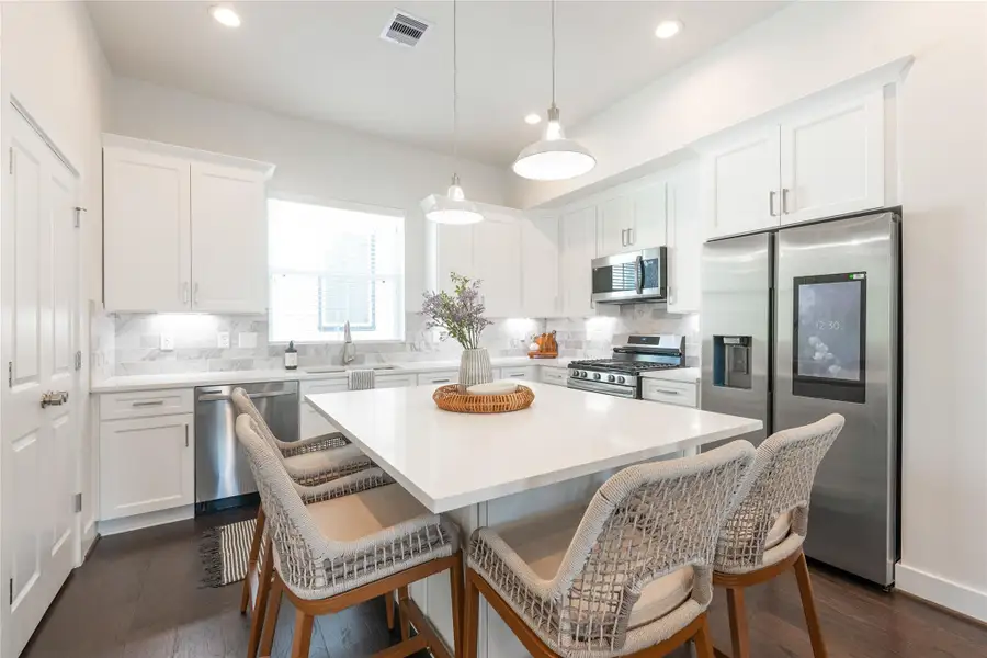 Sleek, modern kitchen with stainless steel appliances, elegant cabinetry, and a spacious island perfect for entertaining. Sleek, modern kitchen with stainless steel appliances, elegant cabinetry, and a spacious island perfect for entertaining.