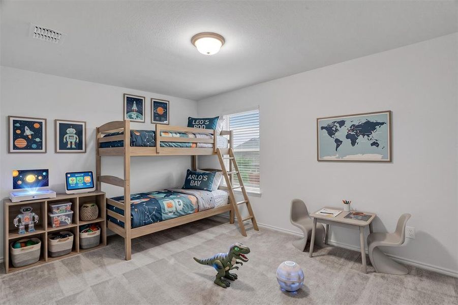 Light-filled room featuring neutral wall paint, recessed lighting, and soft gray carpeting