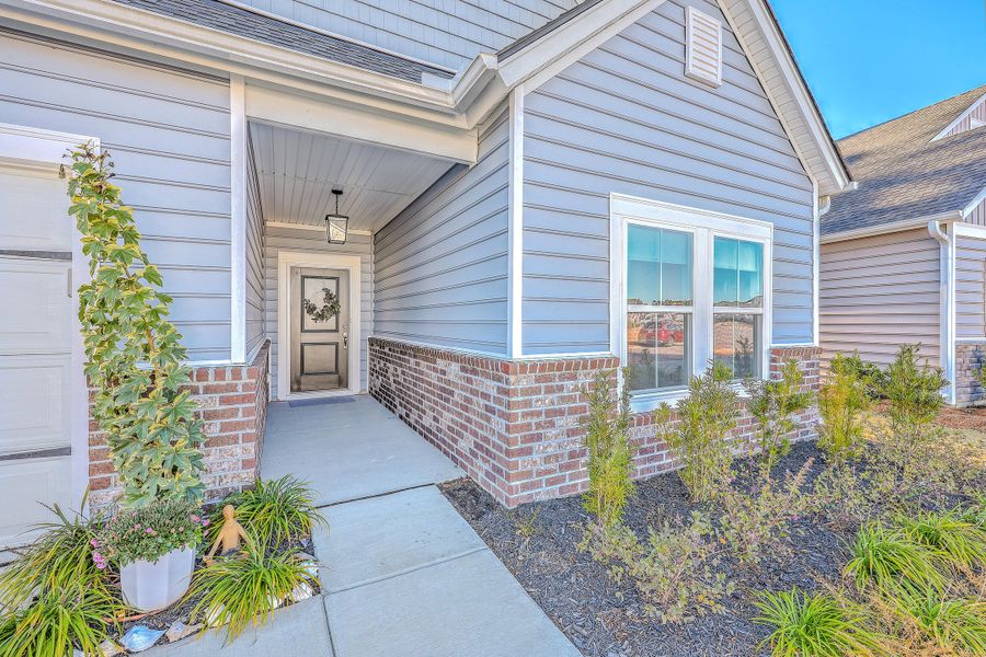 Exterior details and patio area of a home in Horizons at Summers Corner | 55+: The Legends, Summerville (Image 4).