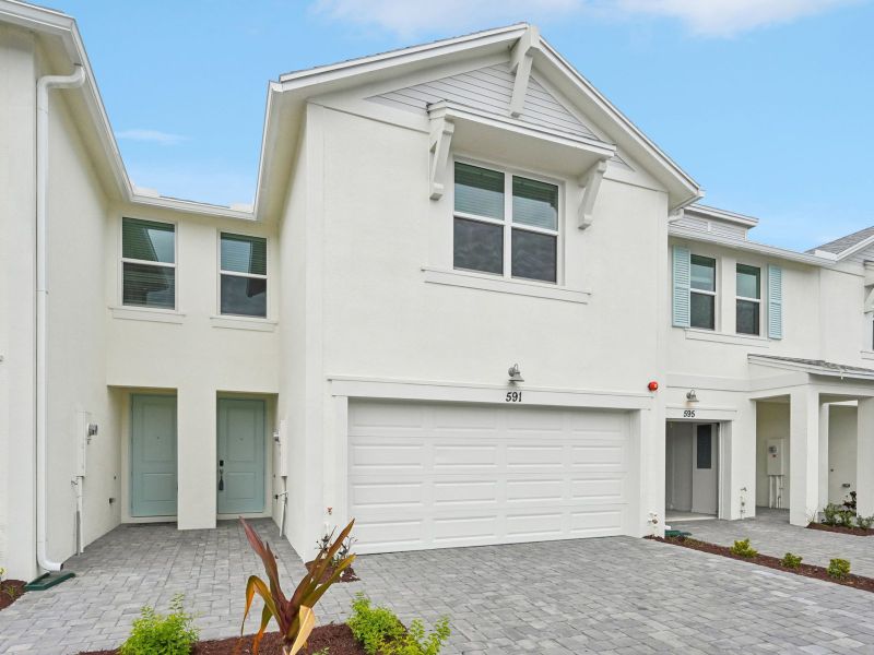 Front exterior of a new home in Tidewater, Fort Pierce, FL, highlighting curb appeal (Image 2). Front exterior of a new home in Tidewater, Fort Pierce, FL, highlighting curb appeal (Image 2).