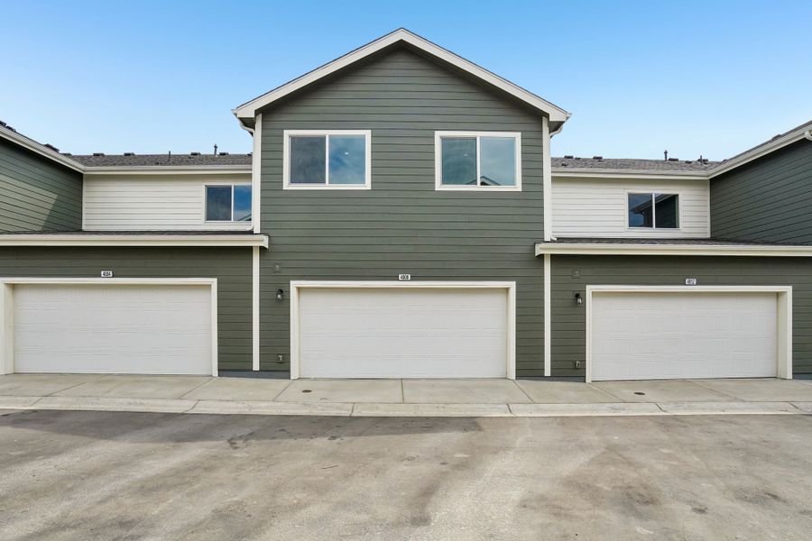 Front exterior of a new home in Liberty Draw, Evans, CO, highlighting curb appeal (Image 21).