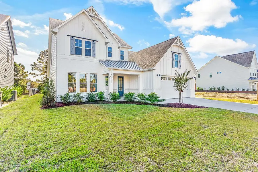 Representative exterior photo of a completed home built from the The Chandler by RobuckHomes in Windwater, Hampstead, NC (Image 2).