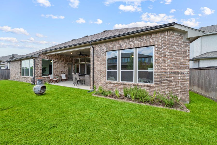 The well-maintained lawn provides plenty of green space for various activities, and the fenced-in yard ensures privacy. The well-maintained lawn provides plenty of green space for various activities, and the fenced-in yard ensures privacy.