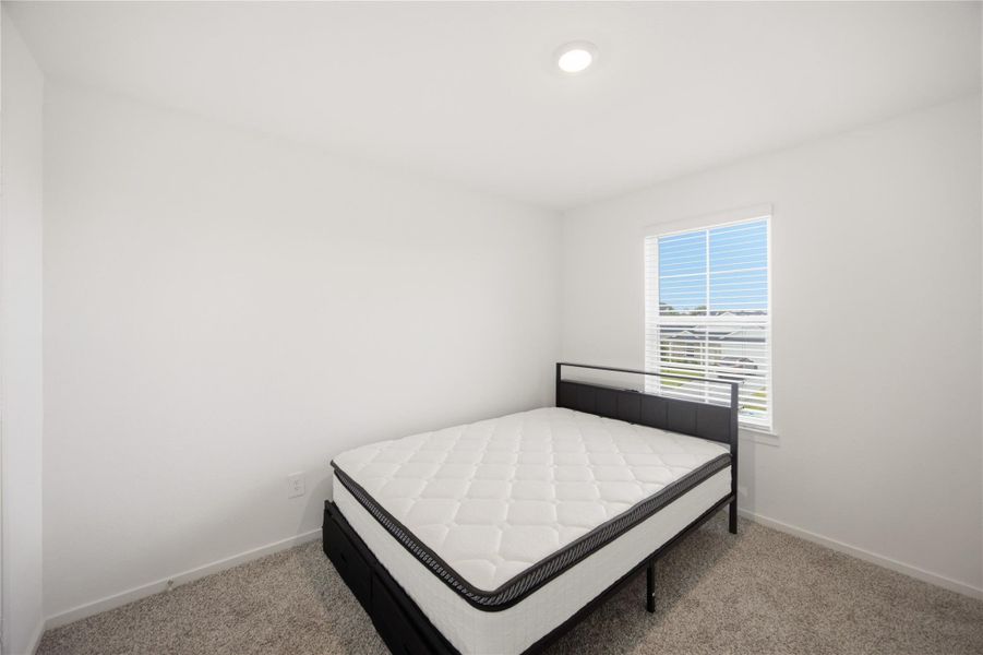Secondary bedroom — Bright secondary bedroom with neutral finishes. Secondary bedroom — Bright secondary bedroom with neutral finishes.