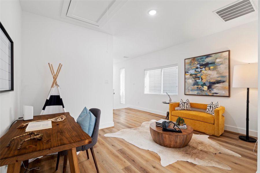 Strategically placed windows allow for abundant natural light, creating an open and airy feel throughout the home.