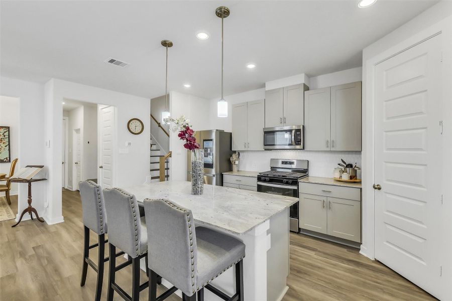 Stylish kitchen overlooking the dining and living areas, creating the perfect setup for entertaining and open-concept living.