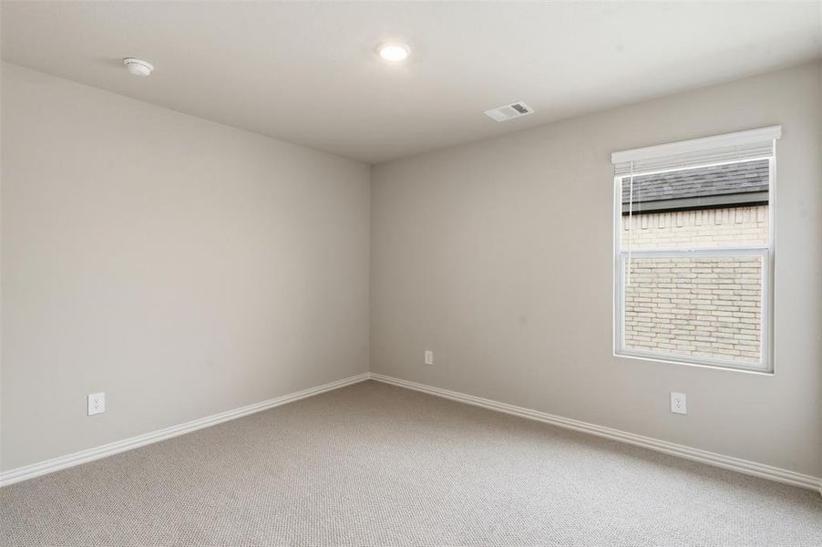 This room features light-colored walls and carpeted flooring