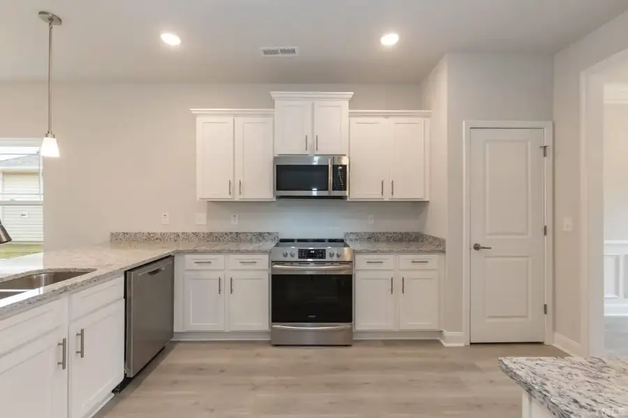Furnished interior view inside a new home in East Lake, Leland (Image 4).