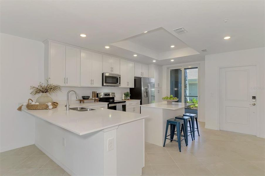 Furnished interior view inside a new home in Wellen Park Golf & Country Club, Venice (Image 8).