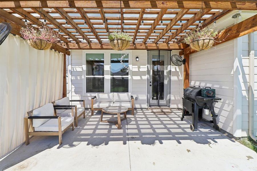 View of patio with a pergola and area for grilling View of patio with a pergola and area for grilling