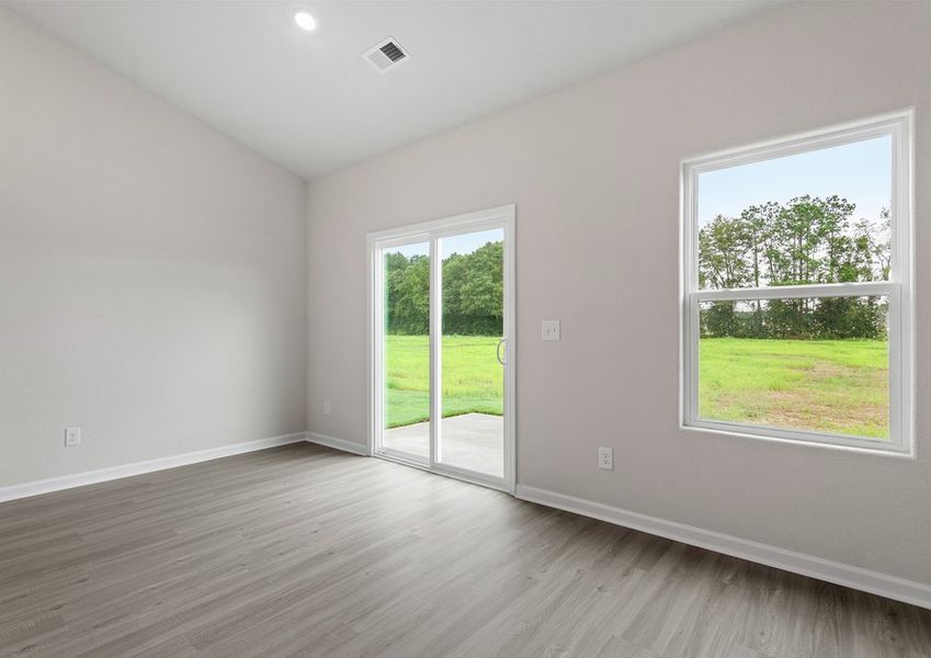 The dining room has a sliding glass backdoor