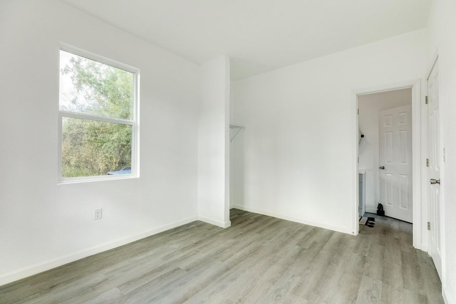 Another view of the primary bedroom.