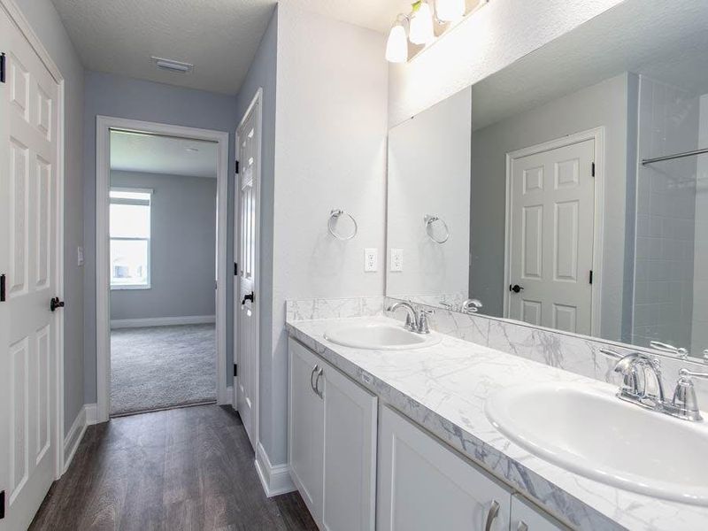 You will appreciate desirable features such as this Jack-and-Jill bath - Wayfair III by Highland Homes You will appreciate desirable features such as this Jack-and-Jill bath - Wayfair III by Highland Homes